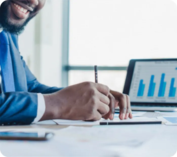 Investor reviewing charts on a laptop