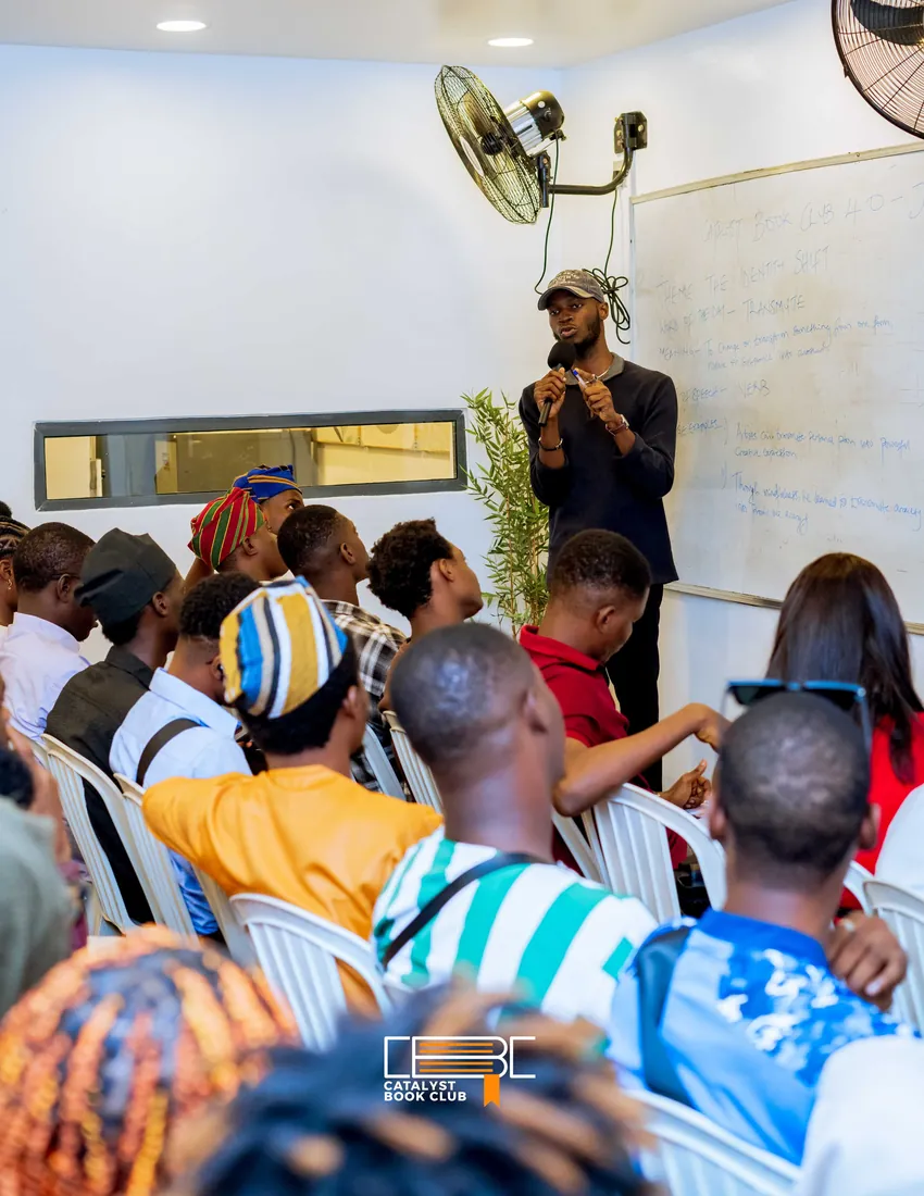 Speaker leading a Catalyst Book Club session for a seated audience