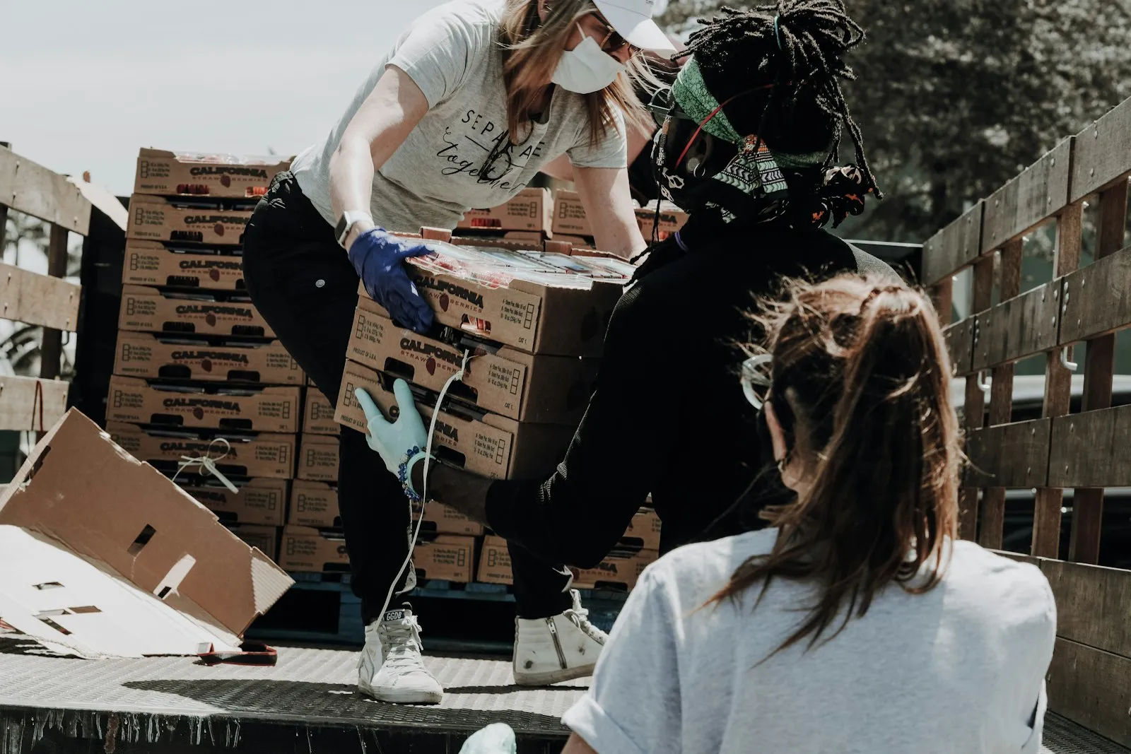 Volunteers unloading donation boxes during a community outreach