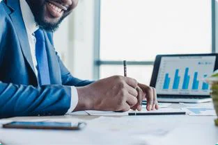 Investor reviewing charts on a laptop