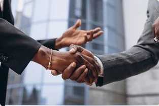 Two business people shaking hands